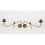 A pair of W A S Benson cantilever candlesticks, ball counterweight, the scroll stem on two arched