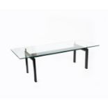 A Cassina LC6 enamelled metal and glass dining table designed by Le Courbusier, originally