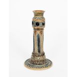 An early Martin Brothers stoneware candlestick by Robert Wallace Martin, dated 1875, stepped