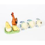 A Clarice Cliff Bizarre Chick cruet set, painted in colours, comprising salt and pepper pots,