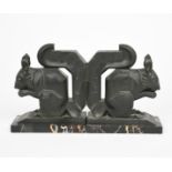 Max Le Verrier A pair of large patinated metal squirrel bookends, each modelled seated and eating