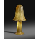 A large and impressive Daum Nancy acid etched table lamp, mushroom shaped amber glass shade with