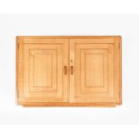 A Gordon Russell cherry wood hanging wall cabinet, twin, hinged panel doors with box wood