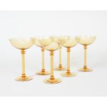 A set of six Compagnia Venezia Murano glass champagne bowls, amber glass, shallow foot with fluted