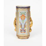 An Aesthetic Movement Coalport vase, elliptical, cylindrical form applied with two dragon handles,