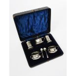 A Jones and Crompton silver cruet set, each stamped in low relief with simple Art Nouveau tulip