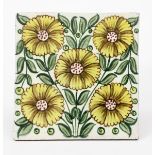 A William De Morgan Bedford Park Anemone tile, painted with five flowers in shades of yellow,