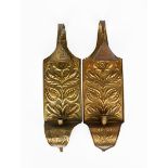 A pair of patinated brass wall sconces, each rectangular with curved tapering finial and base, one