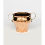 A Birmingham Guild of Handicraft brass twin-handled jardiniere, swollen form, the hammered body with