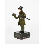 ? A Jozel The Bookseller a patinated bronze and ivory figure, on veined black marble base stamped