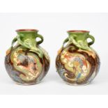 A pair of C H Brannam Barnstaple pottery vases by Arthur Babcock, dated 1900, ovoid with flaring