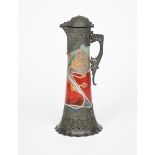 A Jugendstil pewter mounted glass claret jug, the tapering cylindrical glass body enamelled with