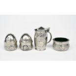 A rare Liberty & Co Solkets pewter cruet set designed by Archibald Knox, model no.0348, cast in