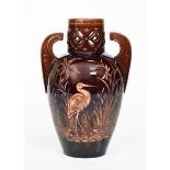 An Aesthetic Movement Wedgwood Vigornian vase, shouldered form with winged handles, the