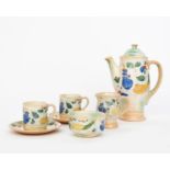 A Royal Doulton 'Brangwyn Ware' Harvest coffee set for two designed by Frank Brangwyn, decorated