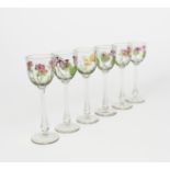 A set of six enamelled glass wine glasses the design attributed to Helen or Hannah Walton, the clear