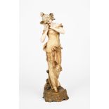 An Ernst Wahliss Pottery figure of an Art Nouveau maiden, model no.4606, modelled standing holding a