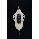 ? A continental silver and ivory pendant in the manner of Dagobert Peche, the carved ivory panel set