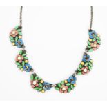 A silver and enamel flower necklace attributed to Bernard Instone, six small panels of stylised