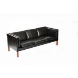 A Danish black leather three seat sofa in the manner of Borge Mogensen, black leather cushions,