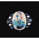 A George Hunt silver and enamel brooch, dated 1937, the wirework frame with blue enamelled leaves