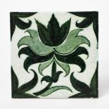 A William De Morgan Merton Abbey Period tile, painted with a foliage design in green on a white