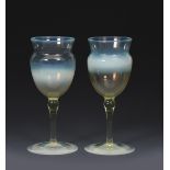 A pair of James Powell & Sons Whitefriars straw opal wine glasses designed by T G Jackson, with