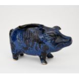 A Baron Barnstaple pottery pig vesta holder, naturalistically modelled and glazed blue, incised