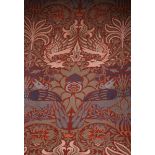 A long pair of Morris & Co Peacock and Dragon hand-loom jacquard woven wool curtains designed by
