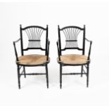 A pair of Morris & Co ebonised wood Rossetti chairs possibly designed by Dante Gabriel Rossetti,