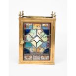An Aesthetic Movement brass and stained glass hall lantern, square section, the four sides set