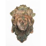 An Art Nouveau wall pocket the design attributed to Karel Novak, cast in relief with mask, incised