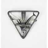 A Georg Jensen silver brooch designed by Arno Malinowski, model no. 257, triangular form, pierced