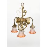 An English brass three branch ceiling light, with three foliate branches and brass reflector leaves,