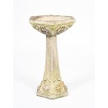 An Art Nouveau stoneware birdbath, hexagonal section, cast in low relief with sinuous foliate