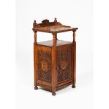 An oak pot cupboard dated 1897 the design attributed to Arthur Simpson of Kendal, rectangular form