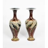 A pair of Art Nouveau Doulton Lambeth stoneware vases by Eliza Simmance, slender baluster form,