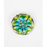 A James Fenton silver and enamel Tudor Rose brooch, cast in low relief and enamelled in lime green