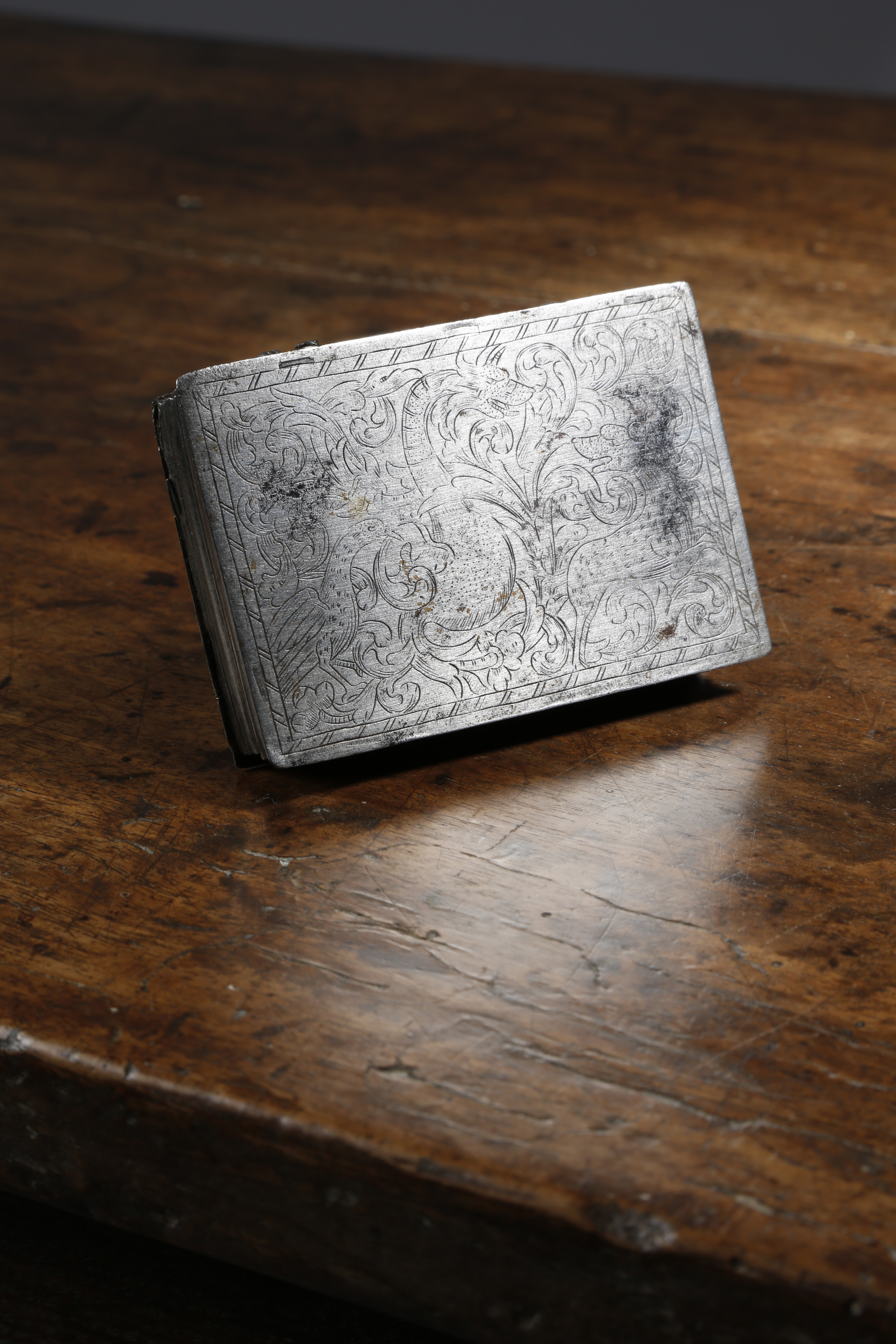 A RARE 17TH CENTURY STEEL SNUFF BOX C.1670-80 the hinged lid finely engraved with a leopard, a