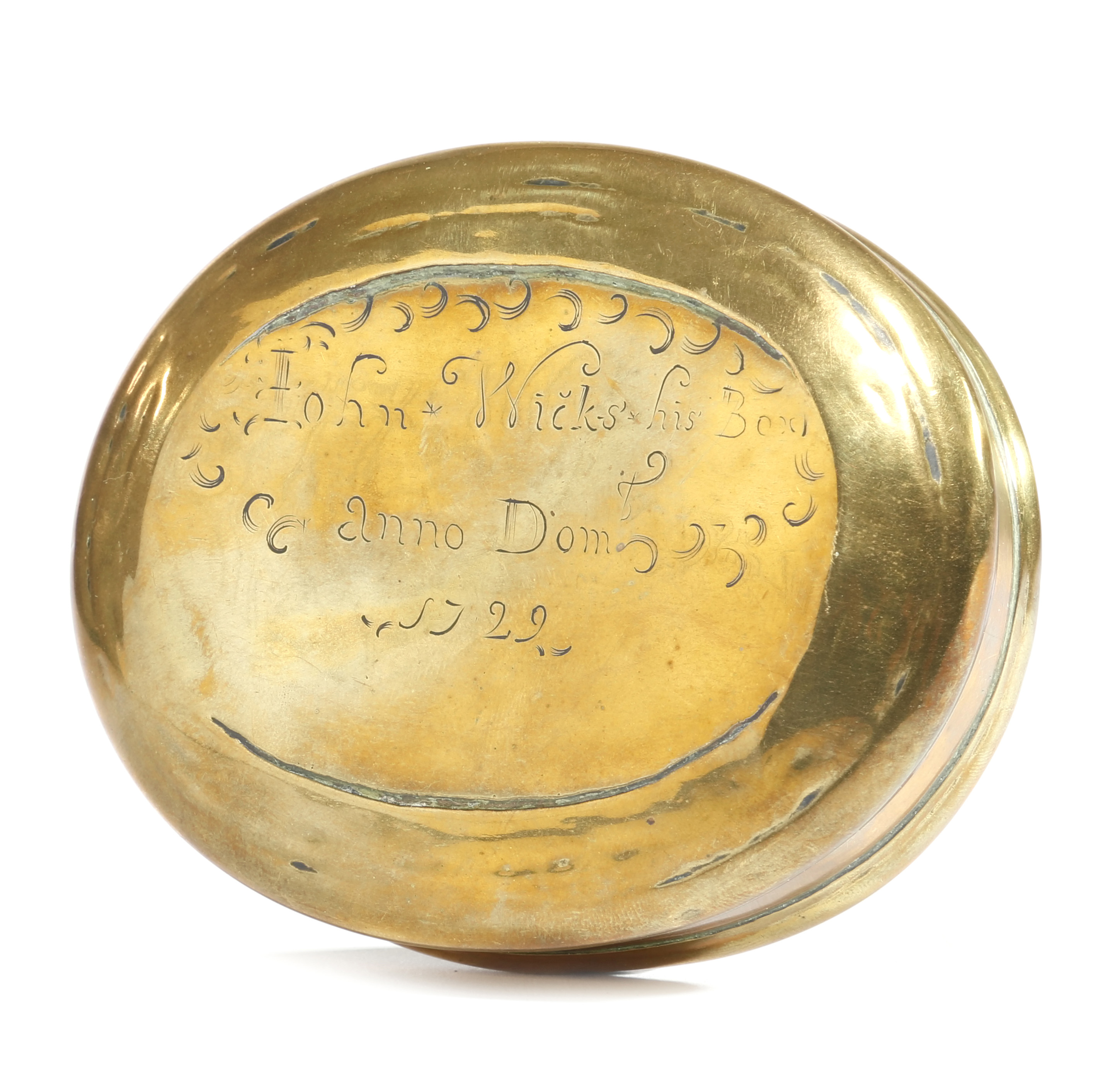 A GEORGE I BRASS OVAL SNUFF OR TOBACCO BOX DATED '1722' the pull-off cover inscribed 'John Wicks his