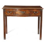 A GEORGE III MAHOGANY SERPENTINE SIDE TABLE C.1770 the moulded edge top above three frieze