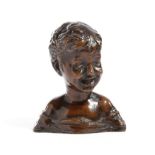 A BRONZE BUST OF A SMILING YOUNG BOY PROBABLY ITALIAN, EARLY 20TH CENTURY unsigned 11.2cm high, 9.