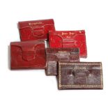 FIVE SMALL LEATHER PURSES / MINIATURE BOOKS EARLY 19TH CENTURY AND LATER comprising: three red