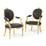 A PAIR OF GEORGE III GILTWOOD ARMCHAIRS ATTRIBUTED TO FRANCOIS HERVE, C.1790 each with an oval