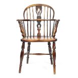 AN ASH AND ELM LOWBACK WINDSOR ARMCHAIR FIRST HALF 19TH CENTURY with a pierced fruitwood splat above