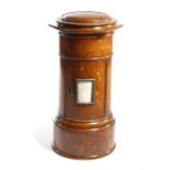A VICTORIAN OAK COUNTRY HOUSE LETTER BOX C.1870-80 of pillar box form, the top with a slot above a