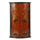 A GEORGE II JAPANNED BOWFRONT HANGING CORNER CUPBOARD MID-18TH CENTURY the red lacquer doors