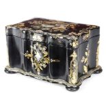 A VICTORIAN PAPIER-MACHE TEA CADDY C.1860 inlaid with mother of pearl and decorated with flowers and