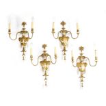 A SET OF FOUR GILTWOOD AND COMPOSITION WALL LIGHTS IN ADAM STYLE, 19TH CENTURY each with twin lights