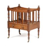A REGENCY MAHOGANY CANTERBURY C.1815 with three dipped divisions and baluster and ring turned